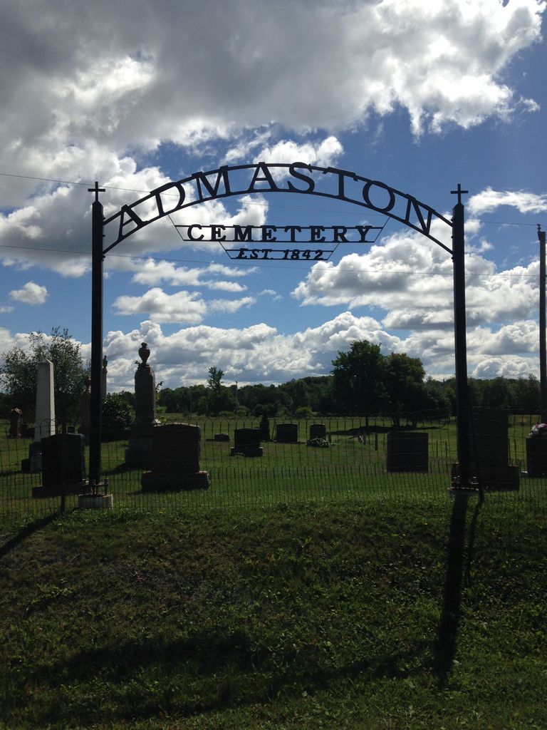 Entrance sign at Admaston Cemetery with memorial grounds behind it.